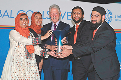 Student winners of the Hult Prize with President Bill Clinton