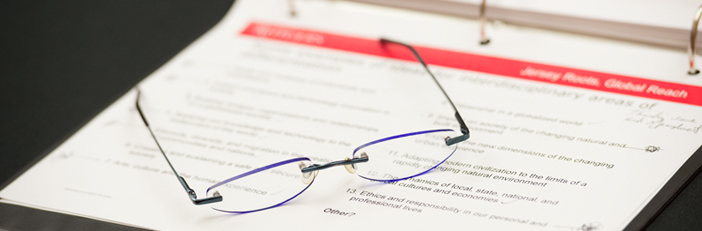 Glasses sitting on an open binder